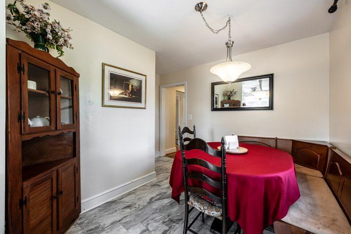 Dining room with an oval table and a built-in corner bench