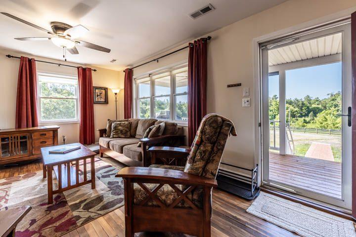 Living room with a glass door opening to the porch
