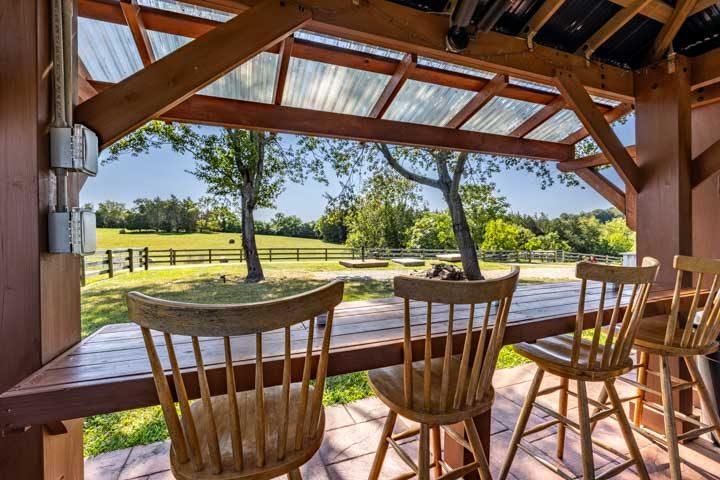 Bar-height seating at the pavilion looking out over the fence line
