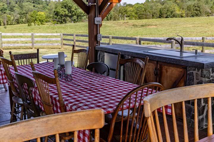Pavilion dining table beside the outdoor kitchen